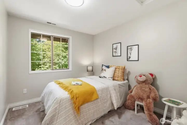 Spacious third bedroom with fresh paint, and peaceful yard views. Spacious third bedroom with fresh paint, and peaceful yard views.