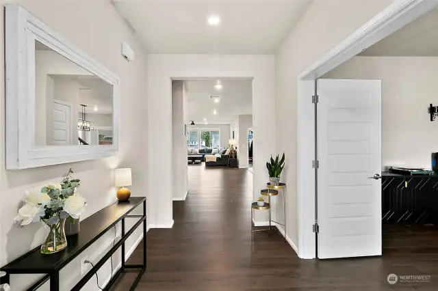 A spacious entry and the luxury vinyl planked (LVP) flooring not only adds a touch of modern flair but also ensures durability and easy maintenance, perfect for busy households.