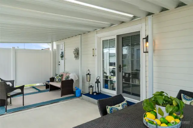 French door to generous covered patio with skylighting panels