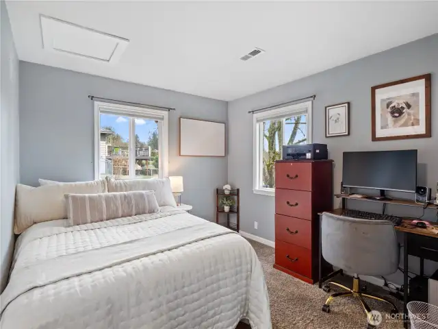 A bright and airy bedroom with cozy ambiance.