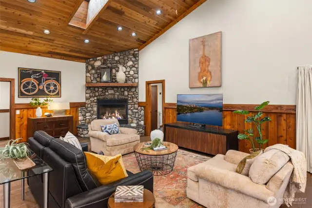 Soaring ceilings in this annex room , great place to lounge and use as a flex space or game room.