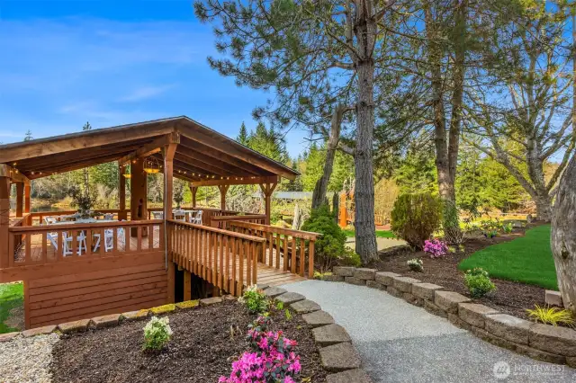 A rustic yet elegant pavilion perched on the lakes edge.