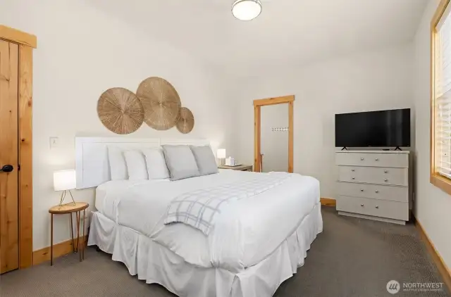 Upper level primary suite with attached bath and territorial views