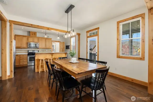 Spacious dining area opens to kitchen and living room