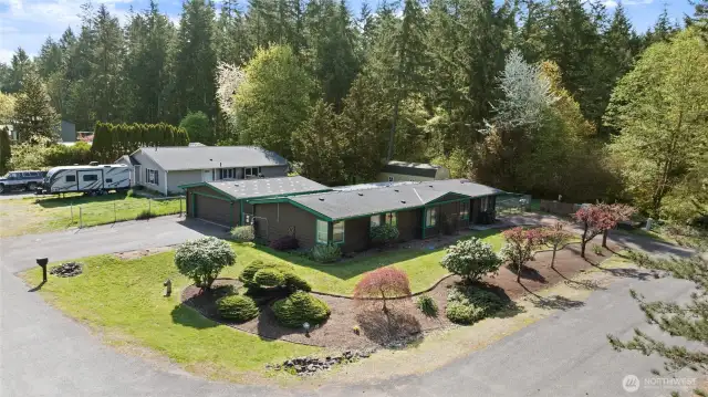 Mature gorgeous landscaping on your corner lot at dead end.