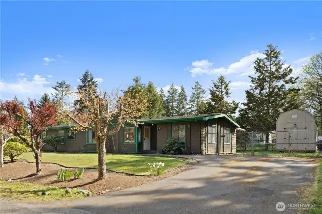 Driveway to your home features a double gate to easily access your back and side yard.