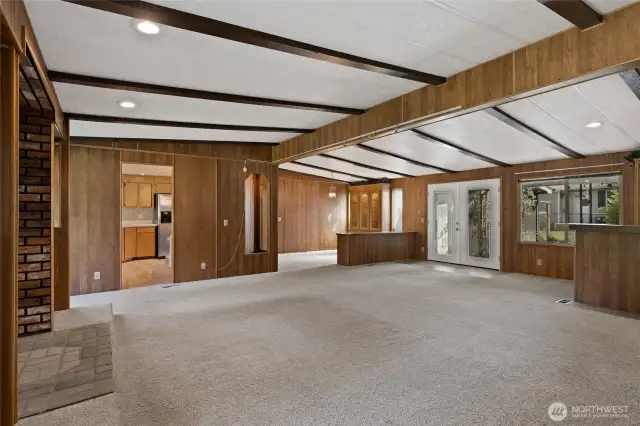 Welcome Home, looking in from entry. Vaulted Ceilings with beams and open living concept.