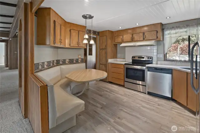 Another view of the Kitchen and built-in eating area.