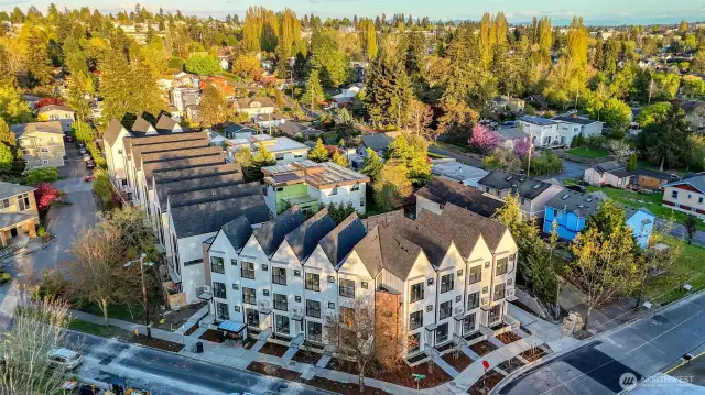 Aerial view of Elm showing off its charming gable architecture and ideal corner location—steps from neighborhood parks, dining, and shopping!