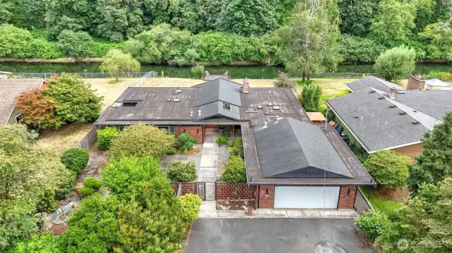 Stunning one of a kind river-front mid-century home!