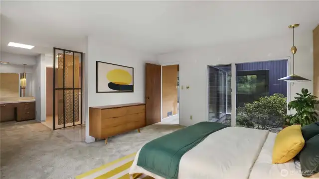 Enjoy the privacy in the primary bedroom with open en-suite, large windows and built-in closets. ***Virtually Staged***