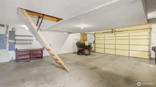 Staircase leads to the attic for additional storage.