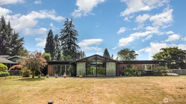 Plenty of outdoor space in this large level backyard.