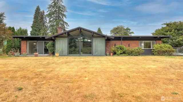 Plenty of outdoor space in this large level backyard, enjoy as-is or come make it your own!