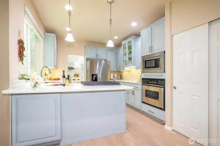 Kitchen with newer Stainless-Steel Appliances & Pantry.