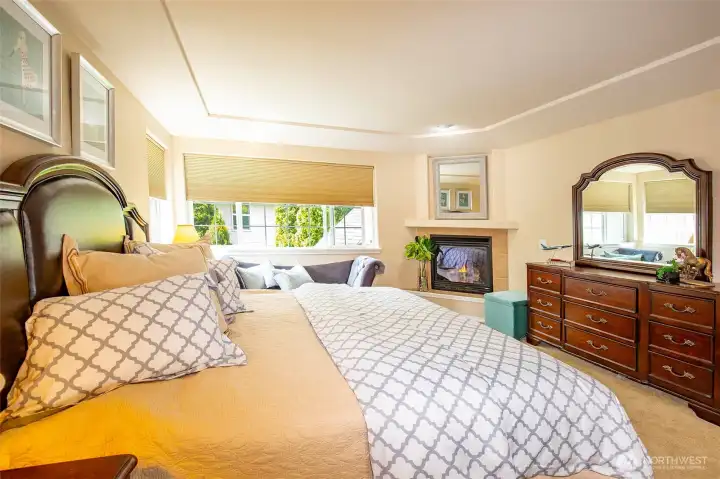 Primary Bedroom with Corner Gas Fireplace.
