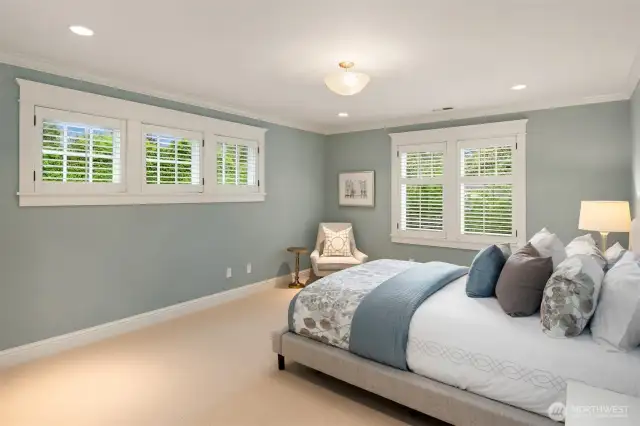 The first of three secondary bedrooms comes with an en-suite full bath and walk-in closet.  Great light in this room!