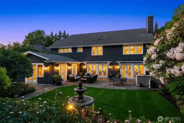 A view from behind the fountain shows off the French doors and patio.