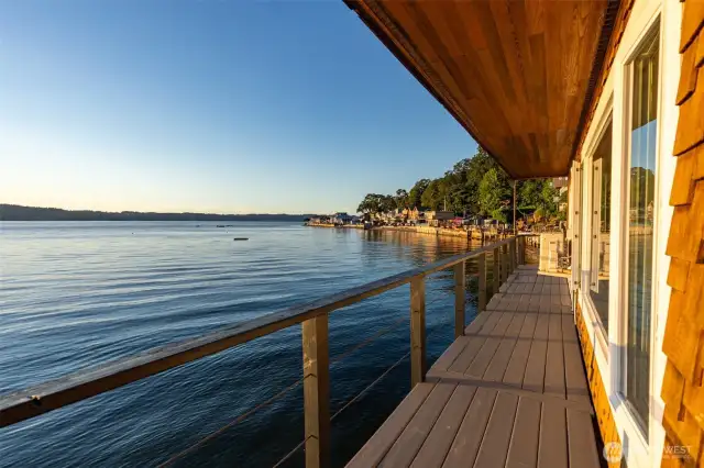 The deck runs along the length of the back of the home.