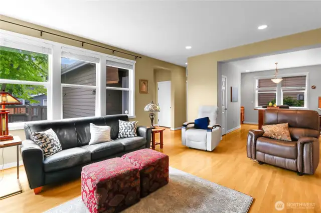 The family room is steps from the kitchen and adjacent to the formal dining room. The door on the background of this photo is the door that leads into the spacious two car garage.