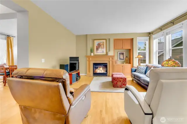A cozy gas fireplace highlights the family room and features tile facing and an elegant wood mantle.