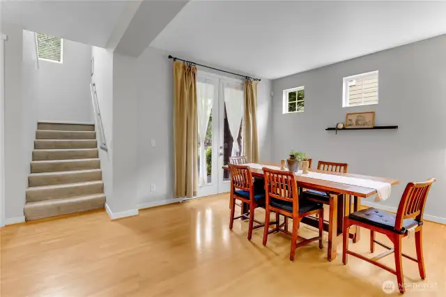 The stairs leading to the upper level have a large window in the landing area which lets in natural light and sunshine.