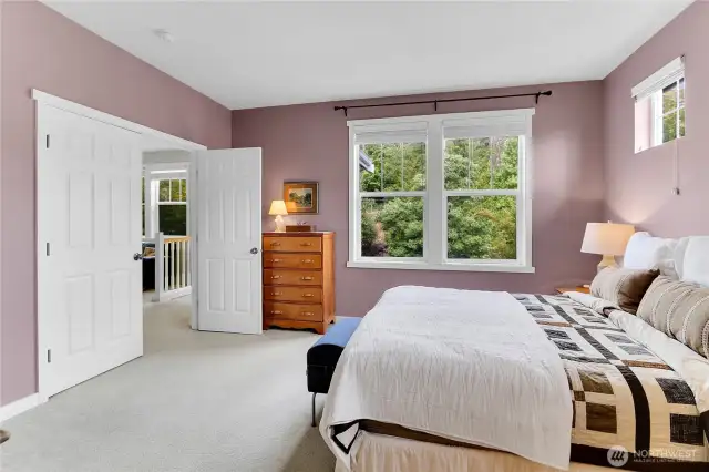 Double doors lead into the upper level primary bedroom which is very comfortable.