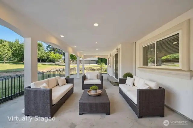 640 SF Covered Patio that opens up to the backyard. Huge Lot