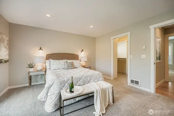 Enjoy the luxury of a walk-in closet with organizers.