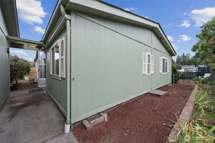 Back entry to garage & a peek at the side yard!