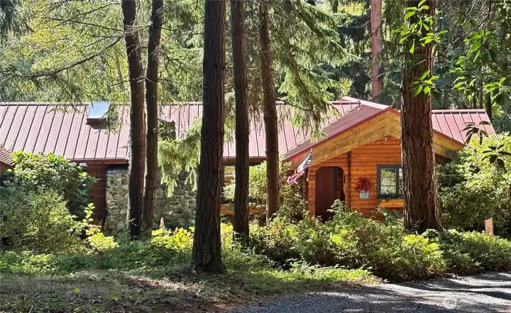 Rambler style custom Pan Abode cedar home,with skylights and lots of windows.