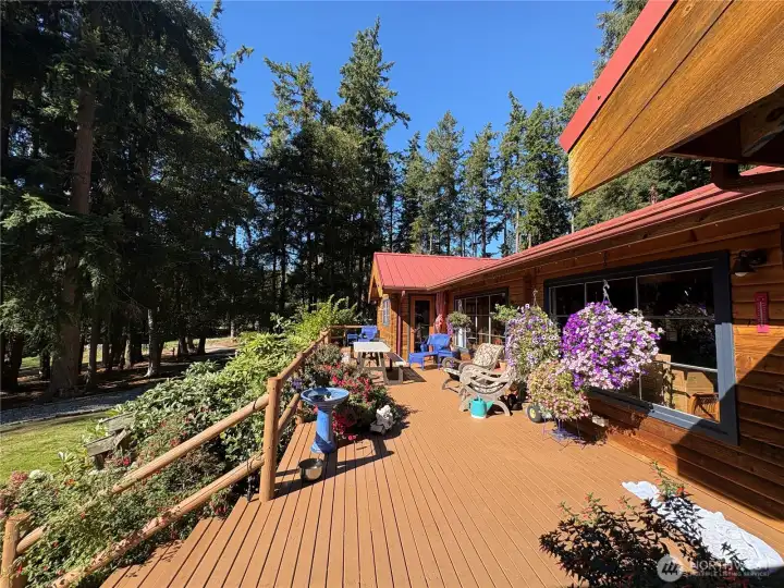 The primary bedroom is large, w/vaulted ceilings and opens to the deck.
