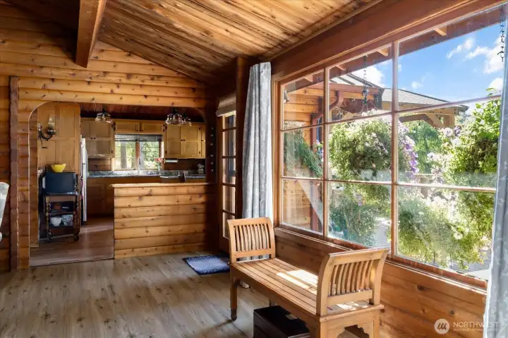 The Great Room is open to the large outside deck and pavilion covered area too.  Everything overlooks the park-like yard spaces.