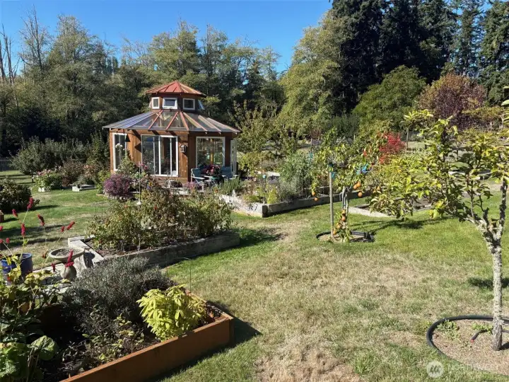 Go inside this amazing Gazebo surrounded by raised garden beds - gorgeous!