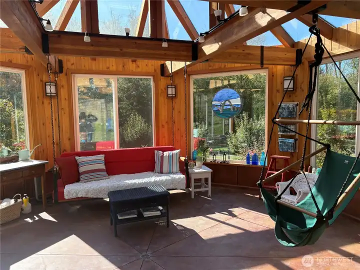 Inside the glassed gazebo is a wonderfully bright, sunny area!  This is just 309 sq feet, but with the outside deck and huge windows, it feels larger. In the winter sun, the gazebo heats up nicely!