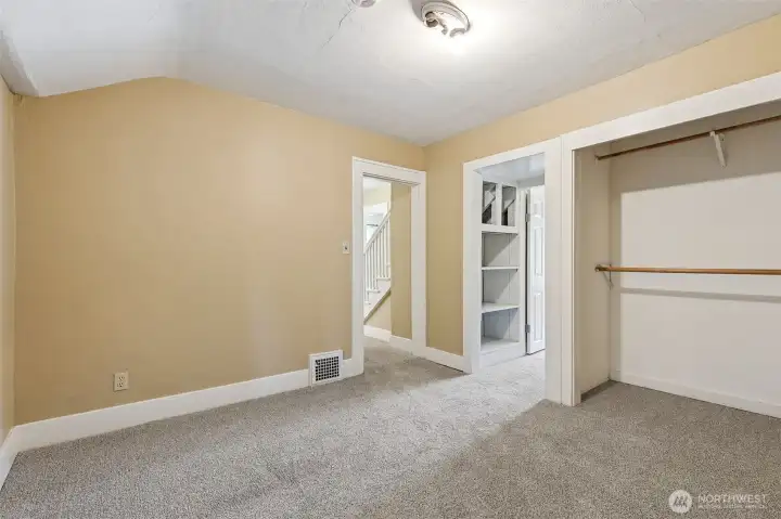 This is the den that is found in between the front bedroom and back primary bedroom with the attached 3/4 bath.