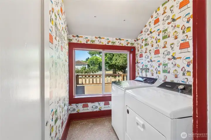 This laundry room in Unit A is anything but ordinary. With a large window overlooking the deck, it’s a bright and airy space. The vintage Peanuts cartoon wallpaper adds a nostalgic touch, while the red accent trim adds just the right amount of flair. It’s a laundry room that makes everyday tasks a little more enjoyable.