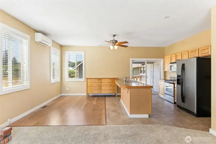 Unit B’s dining nook isn’t just a place to eat, it’s a space that is flexible for your needs. Pergo flooring and wide slat blinds are easy on the eyes, while three windows let the sunshine in. The mini-split A/C keeps you cool, so no one’s breaking a sweat during dinner. And with the living room and fireplace right next door, this nook is always ready to entertain, whether it’s a casual meal or a more elevated gathering.