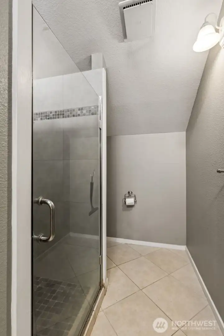 This is the view of Unit B's 3/4 shower and toilet.