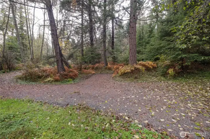 Resurfaced driveway with parking spot.