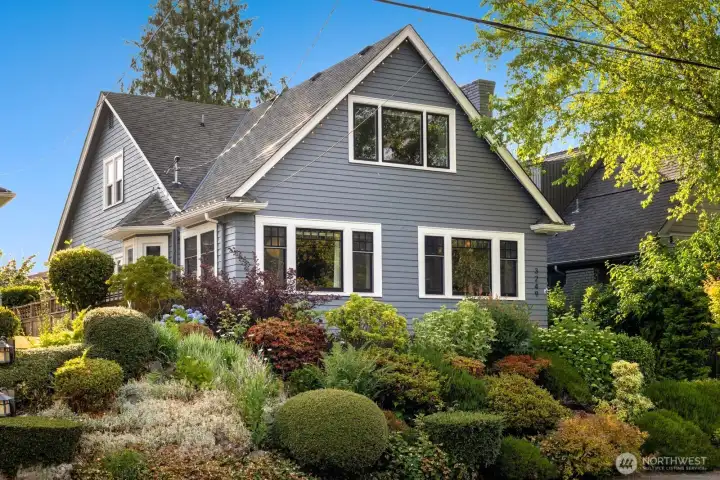 Welcome to this beautifully restored 1928 Craftsman nestled on a quiet street in Magnolia.