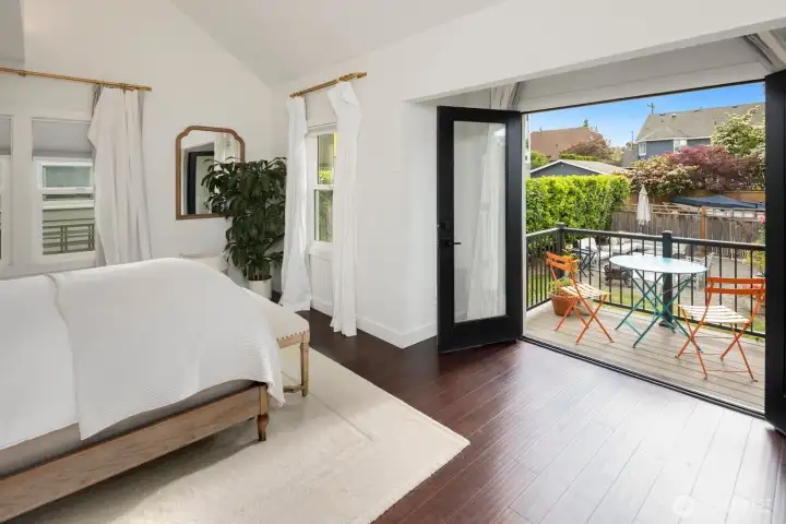 The main level primary suite is a true retreat, offering vaulted ceilings, a luxurious ensuite with double vanity, double shower, and heated floors, plus a generous walk-in closet and private deck—ideal for morning coffee or unwinding at sunset.