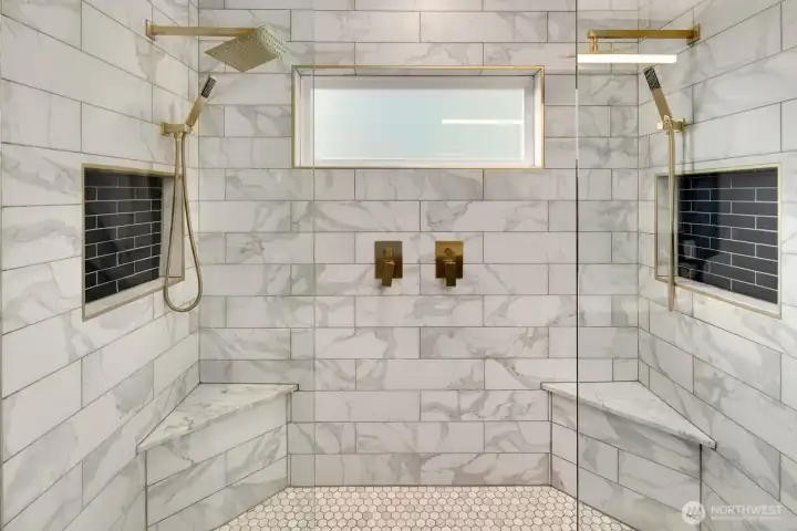 Luxurious ensuite with double vanity, double shower, and heated floors.