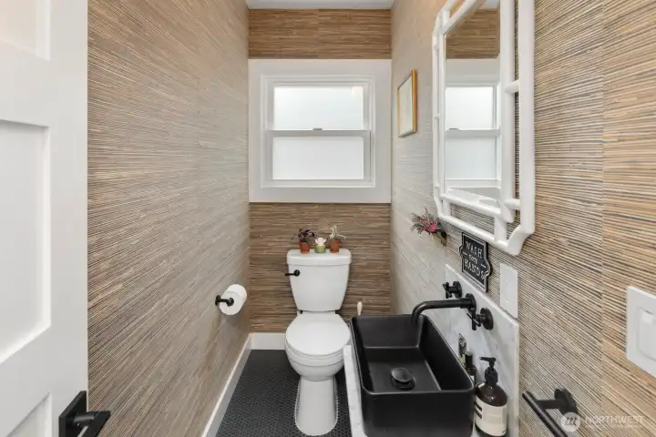 A convenient powder room completes the main level.