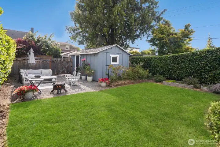Enjoy the beautifully landscaped yard and alley-accessed 1-car garage w/ DADU potential.