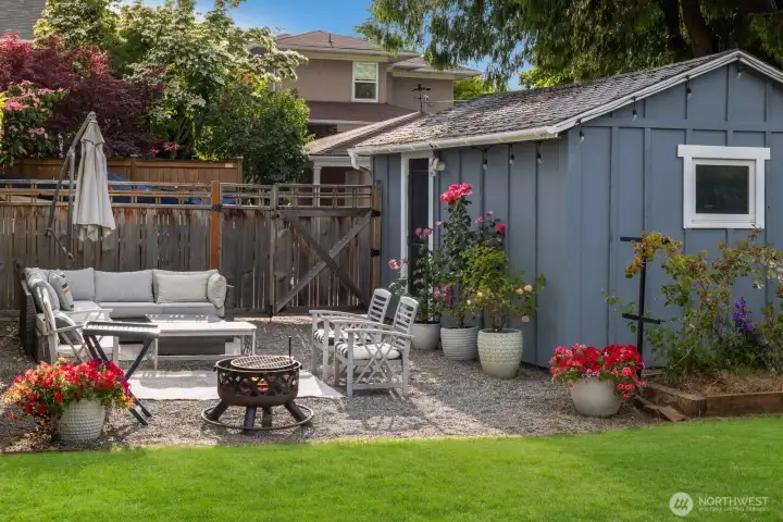 Enjoy the beautifully landscaped yard and alley-accessed 1-car garage w/ DADU potential.