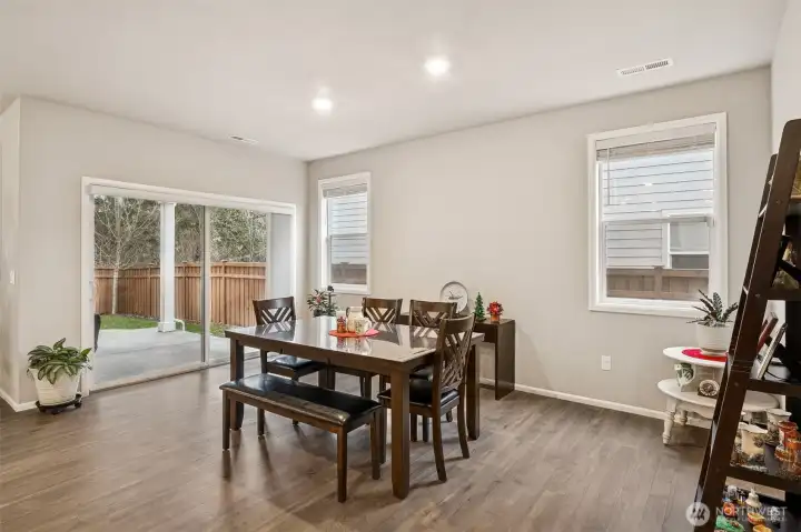 Large dining room with slider out to the covered patio