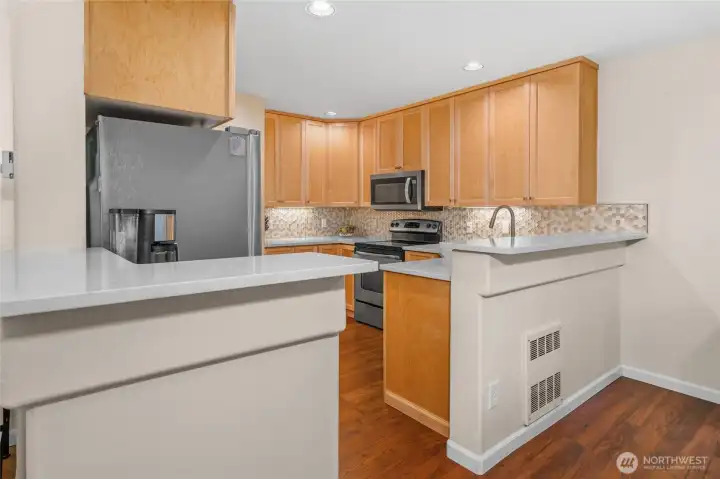 Remodeled kitchen with plenty of coutner space and storage!  Don't miss the pantry with pull out shelving and soft-close cabinetry!