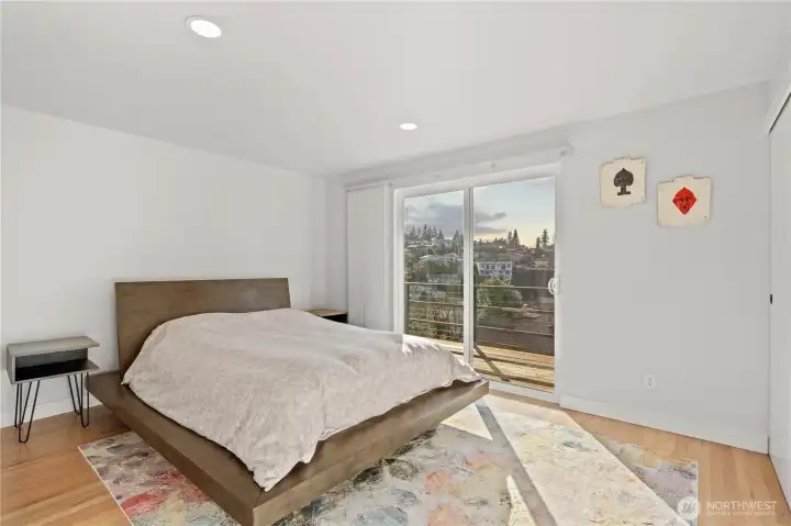 Main floor primary with access to the upper deck!  This is one of two primary suites