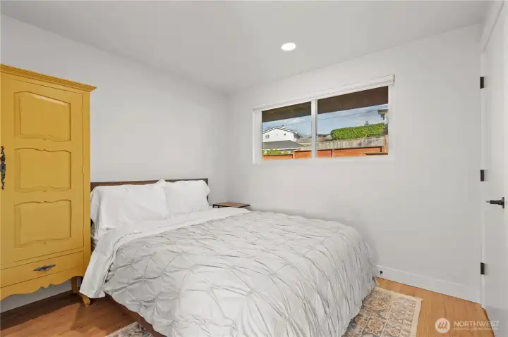 Second bedroom on the main floor is generous in size and has an adjacent full bath